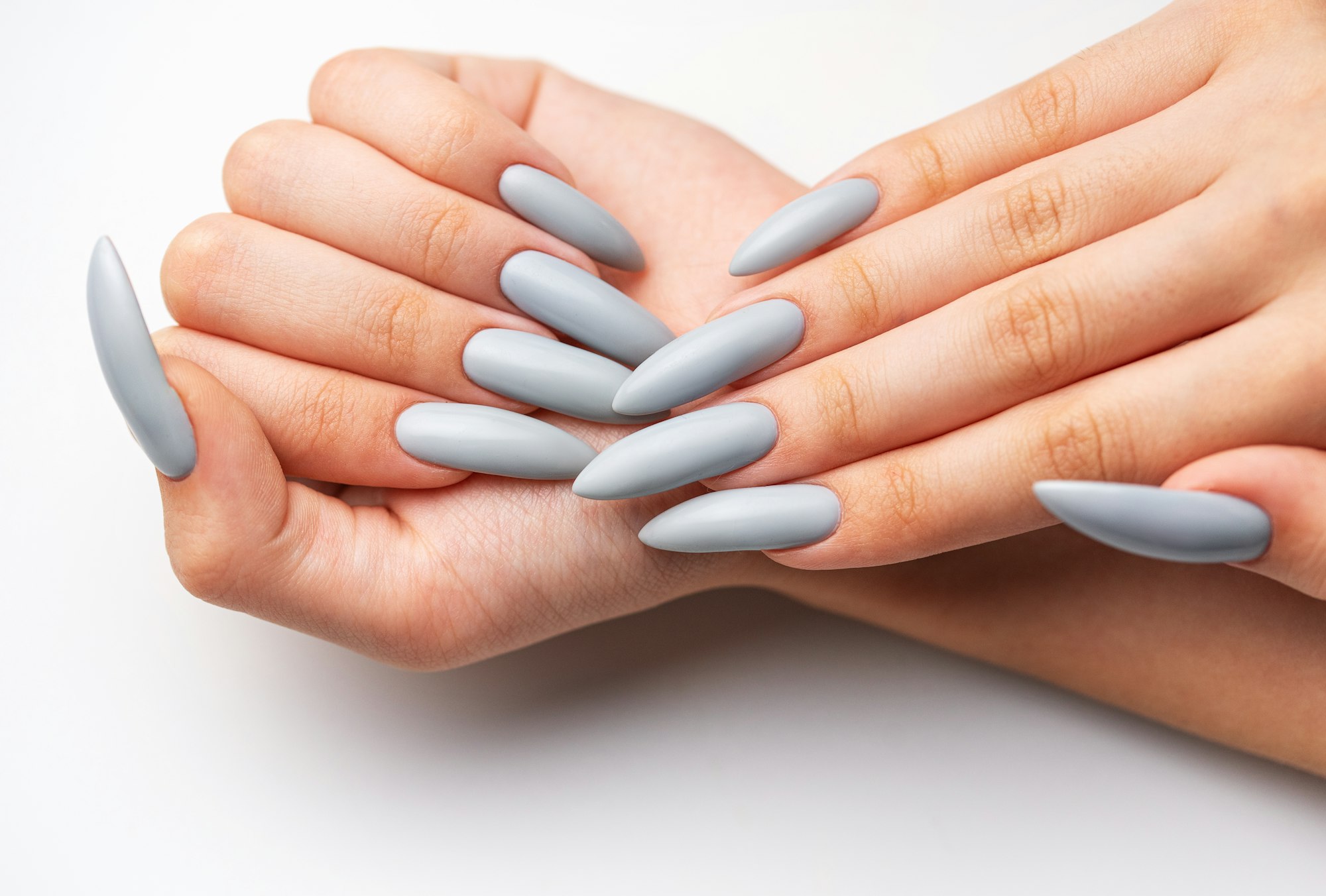 Woman's hand with grey nail polish